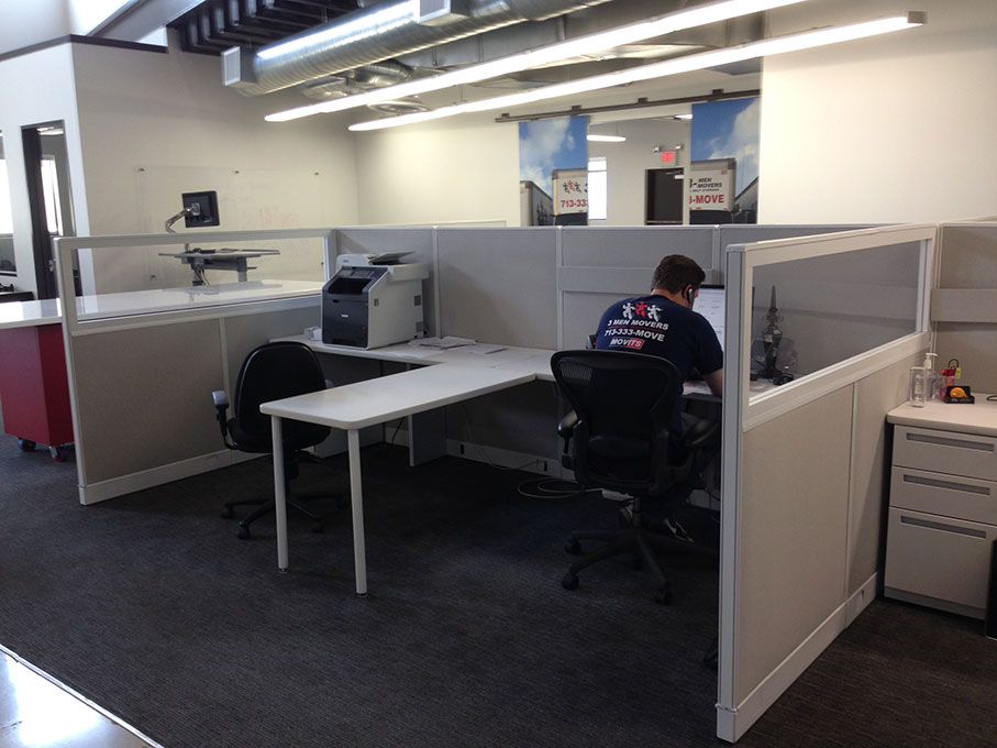 Austin Office Cubicles with a man working on cubicle 