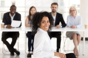 young woman interviewed by a professional panel