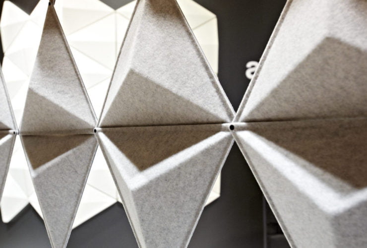 Close-up of Aircone acoustic wall panels inside an exhibition space.