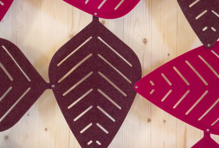 Studio shot of magenta shaded Airleaf acoustics along a wall, up close.