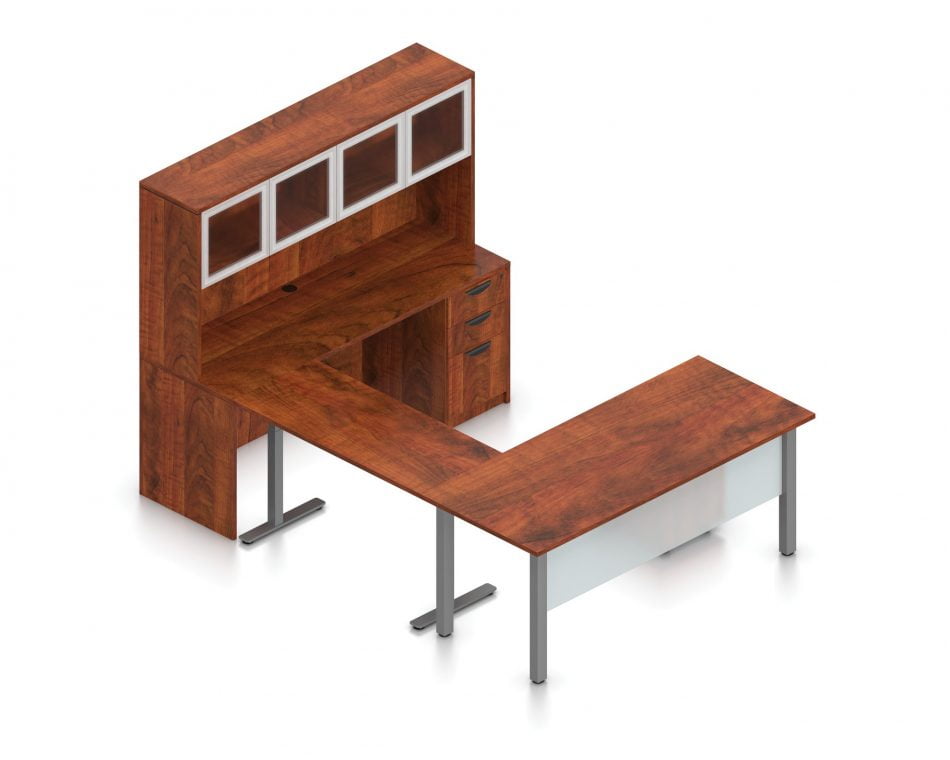 Orthographic view of an Offices to Go desk and table set, using Layout 3. This set consists of a 71" wide metal table and matching width credenza. The hutch above features double silver doors with frosted glass, and provides shelving for storage. An additional set of rolling pedestal file drawers are pushed under the table, with an acrylic privacy panel in front, mounted under the desk. The setup forms an L, connected by a height adjustable table with a tungsten finish. This layout is shown with the American Dark Cherry laminate finish.