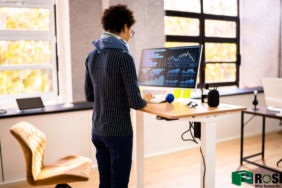 Am an and Adjustable Height Desk Stand In Office